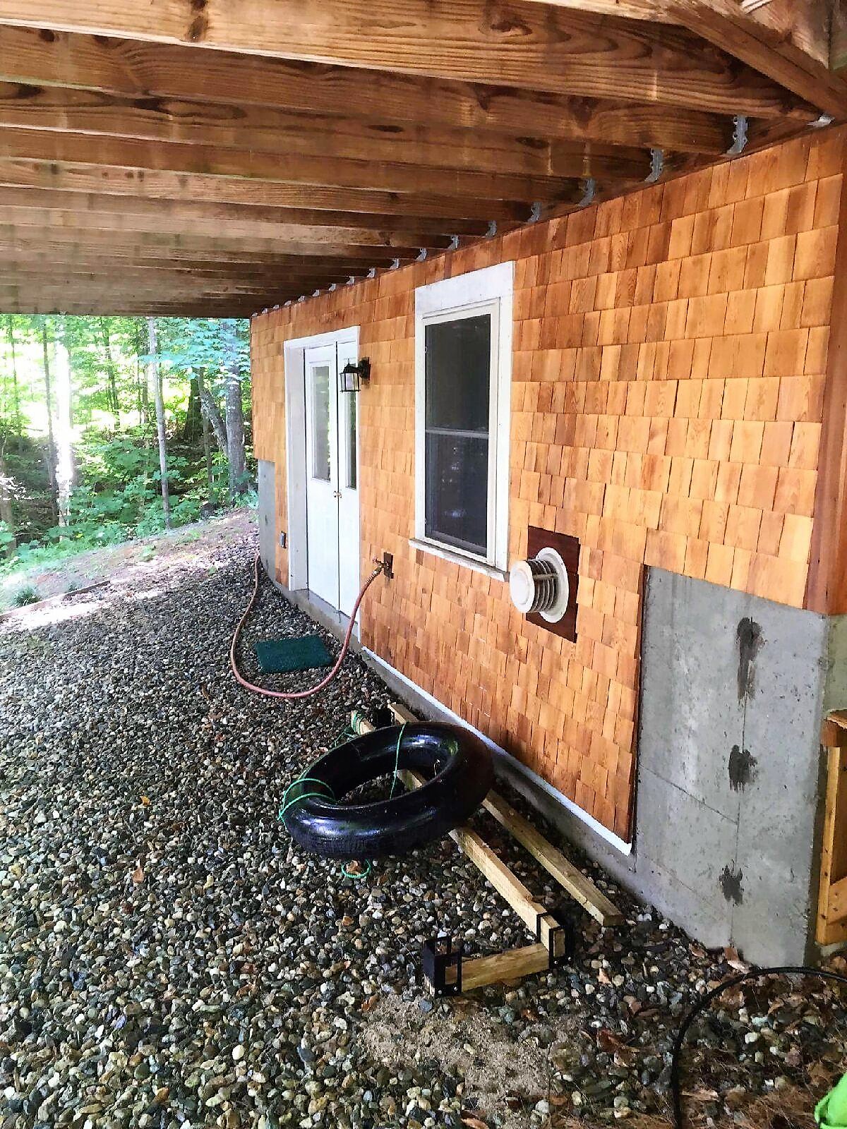 Cedar siding after cleaning - restored natural wood color